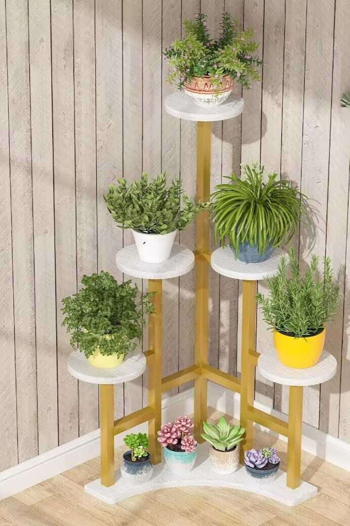 Small wooden tiered plant stand outdoors with potted plants