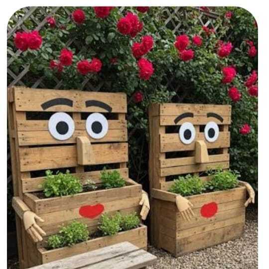 Decorative wood planter boxes with painted faces and hearts by Petal's Leaf