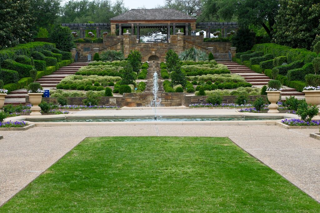 Manicured garden landscape with lawn and pathway